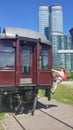 Happy joyful little girl imitate riding on the side of the last train car, old vintage wagon