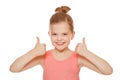 Happy joyful little girl smiling showing thumbs up, isolated on white background Royalty Free Stock Photo