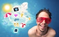 Happy joyful man with sunglasses looking at summer icons Royalty Free Stock Photo