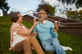 Happy joyful senior couple eating ice-cream in park Royalty Free Stock Photo