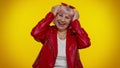 Happy joyful senior old granny woman laughing out loud after hearing ridiculous anecdote, funny joke Royalty Free Stock Photo