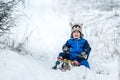 kid toddler with sled happy joyful winter