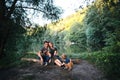 Happy joyful young family father, mother and little son outdoors, hugging together in summer park Royalty Free Stock Photo