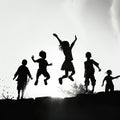 Happy jumping children silhouettes Royalty Free Stock Photo