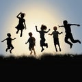 Happy jumping children silhouettes Royalty Free Stock Photo