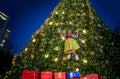 happy jumping up the air asian girl on Christmas present boxes with princess Royalty Free Stock Photo