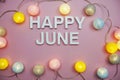 Happy June alphabet letters on pink background