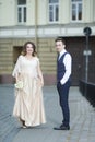 Happy Just Married Couple Having a Stroll Outdoors