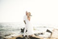 Happy just married young wedding couple celebrating and have fun at beautiful beach sunset Royalty Free Stock Photo