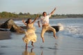 Happy just married young couple jumping Royalty Free Stock Photo