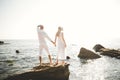 Happy just married young wedding couple celebrating and have fun at beautiful beach sunset Royalty Free Stock Photo