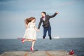 Happy just married young wedding couple celebrating and have fun at beautiful beach sunset Royalty Free Stock Photo