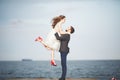 Happy just married young wedding couple celebrating and have fun at beautiful beach sunset Royalty Free Stock Photo