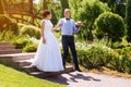 Happy just married young wedding couple having fun in the park. Bride and groom together, love and marriage theme. Royalty Free Stock Photo