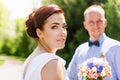 Happy just married young wedding couple having fun in the park. Bride and groom together, love and marriage theme. Royalty Free Stock Photo