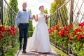 Happy just married young wedding couple having fun in the park. Bride and groom together, love and marriage theme. Royalty Free Stock Photo