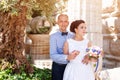 Happy just married young wedding couple having fun in the park. Bride and groom together, love and marriage theme. Royalty Free Stock Photo