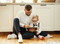 Happy keen father and son using tablet at home