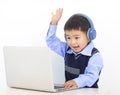Happy kid boy doing homework project on laptop Royalty Free Stock Photo