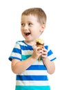 Happy kid boy eating ice-cream in studio isolated Royalty Free Stock Photo