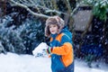 Happy kid boy having fun with snow in winter Royalty Free Stock Photo