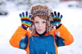 Happy kid boy having fun with snow in winter Royalty Free Stock Photo