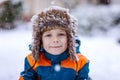 Happy kid boy having fun with snow in winter Royalty Free Stock Photo