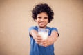 Happy kid boy holds glass of milk. Children, healthcare and food concept