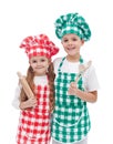 Happy kid chefs with wooden cooking utensils Royalty Free Stock Photo