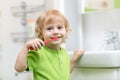 Happy kid or child brushing teeth in bathroom. Dental hygiene. Royalty Free Stock Photo