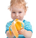 Happy kid or child eating banana