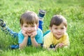 Happy kid enjoying sunny late summer and autumn day in nature on green grass. Royalty Free Stock Photo