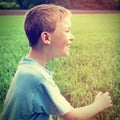 Happy Kid at the Field Royalty Free Stock Photo