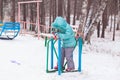 Happy kid girl child outdoors in winter playing and training Royalty Free Stock Photo