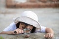 Happy kid girl exploring nature with a magnifying glass and a snail. He having fun in the garden. The concept of the kid is ready Royalty Free Stock Photo