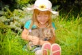 Happy kid girl having fun the summer park with kitten