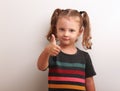 Happy kid girl showing thumb up sign Royalty Free Stock Photo