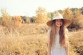 Happy kid girl in straw having fun on summer field Royalty Free Stock Photo