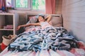 Happy kid girl waking up in early morning in her room Royalty Free Stock Photo