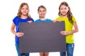 Happy kid girls holding black board copyspace