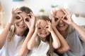 Happy kid granddaughter, mother and grandmother having fun toget Royalty Free Stock Photo