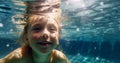 Happy kid have fun in swimming pool. swimming under water, Funny child swim, dive in pool jump deep down underwater from poolside Royalty Free Stock Photo