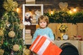 Happy kid having fun with big gift box. Christmas decorations. Wish you merry Christmas. Christmas kids. Models child Royalty Free Stock Photo