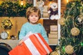 Happy kid having fun with big gift box. Christmas decorations. Wish you merry Christmas. Christmas kids. Models child Royalty Free Stock Photo