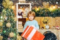 Happy kid having fun with big gift box. Christmas decorations. Wish you merry Christmas. Christmas kids. Models child Royalty Free Stock Photo