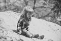 Happy kid having fun. Toddler slide from pile of sand on idyllic sunny day Royalty Free Stock Photo