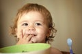 Happy kid having fun. Portrait of sweet baby boy eating Royalty Free Stock Photo