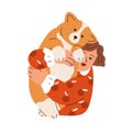 Happy kid holding, hugging cute chunky dog of corgi breed. Girl pet owner with canine animal in arms. Child and doggy