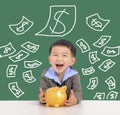 Happy kid holding piggy bank and saving money concept Royalty Free Stock Photo