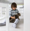 Happy kid at home with cat Royalty Free Stock Photo